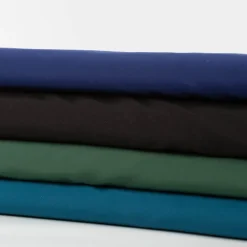 Badeshorts Stoff recycelt wasserabweisend schnell trocknend uni dunkelgrün 1,48m Breite