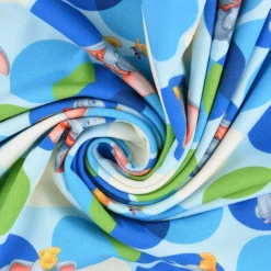 Baumwolljersey Digitaldruck Disney Dumbo Kreise blau grün creme 1,5m Breite