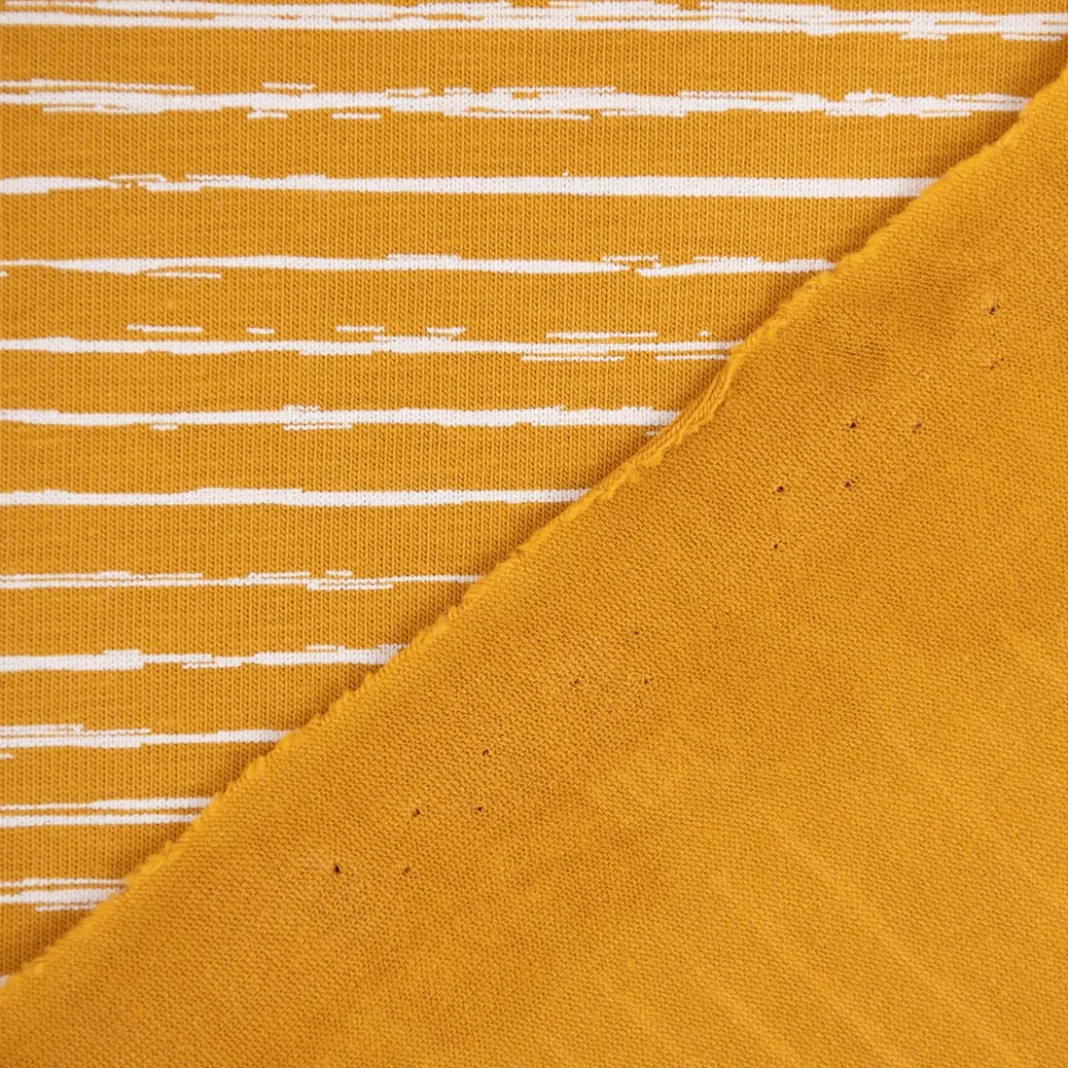 Baumwolljersey Jersey Streifen unregelmäßig ocker weiß 1,45m Breite