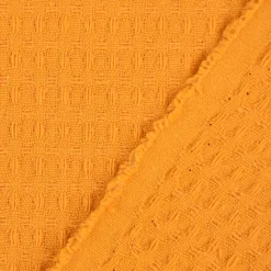 Bekleidungsstoff Waffelpique Baumwolle uni ocker gelb 1,45m Breite