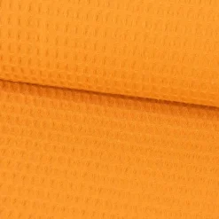 Bekleidungsstoff Waffelpique Baumwolle uni ocker gelb 1,45m Breite