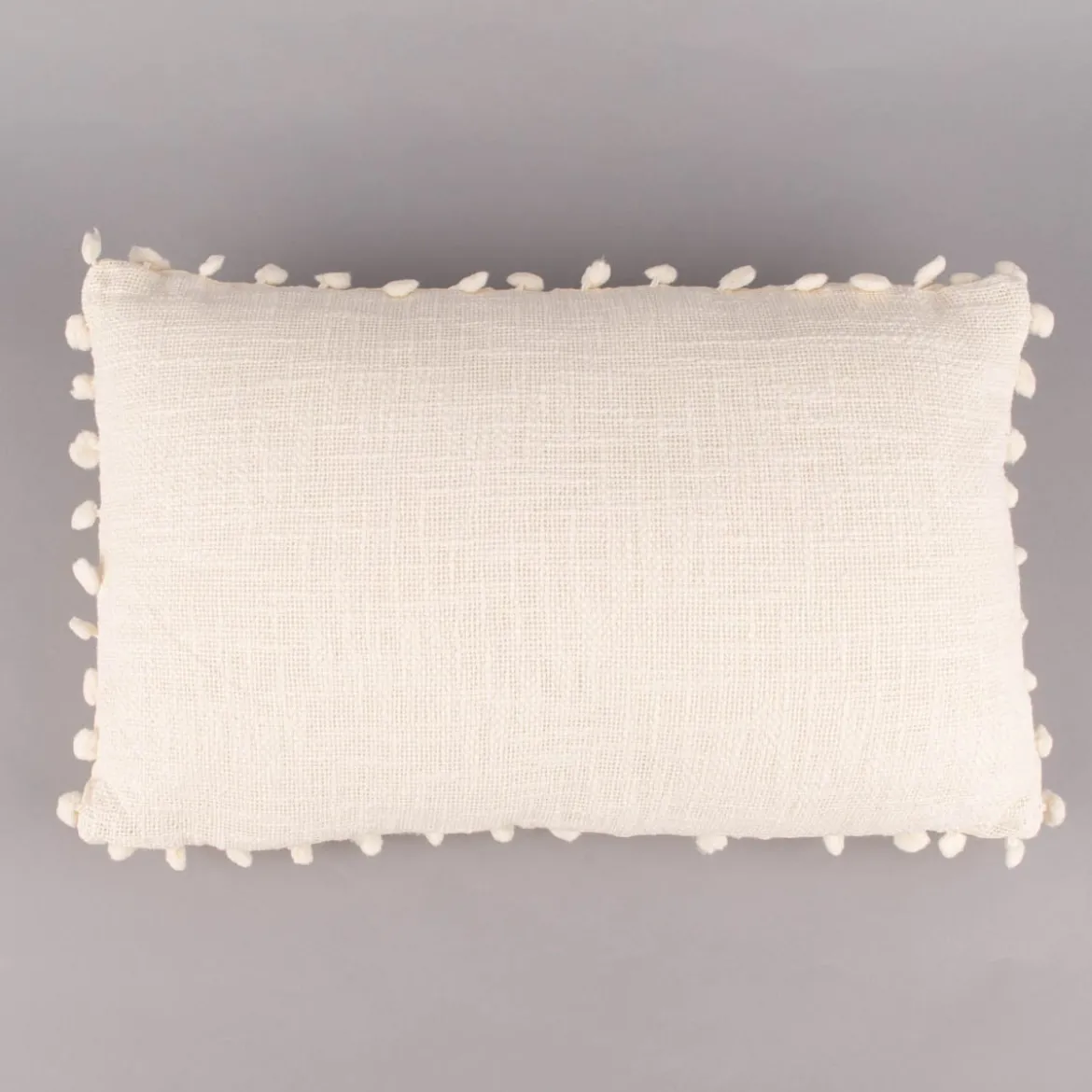 Deko Kissen einfarbig strukturiert mit Pompons ecru 30x50cm