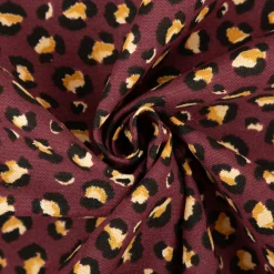 Dekostoff Halbpanama Leomuster Leoprint weinrot gold 1,40m Breite