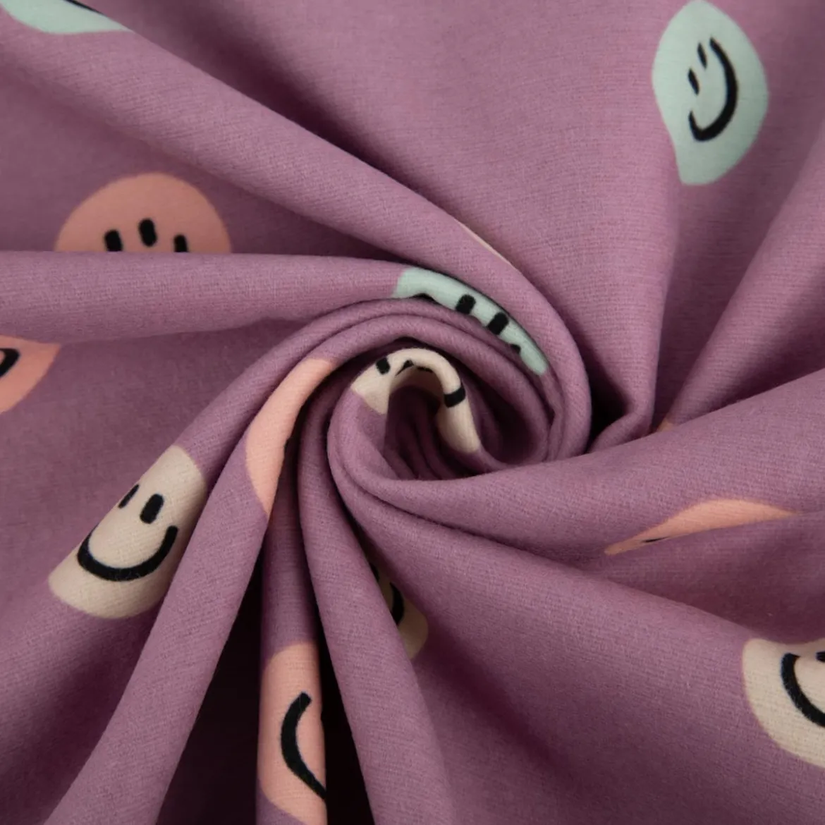 Flanellstoff aus Baumwolle Lachgesichter violett pastell 1,43m Breite