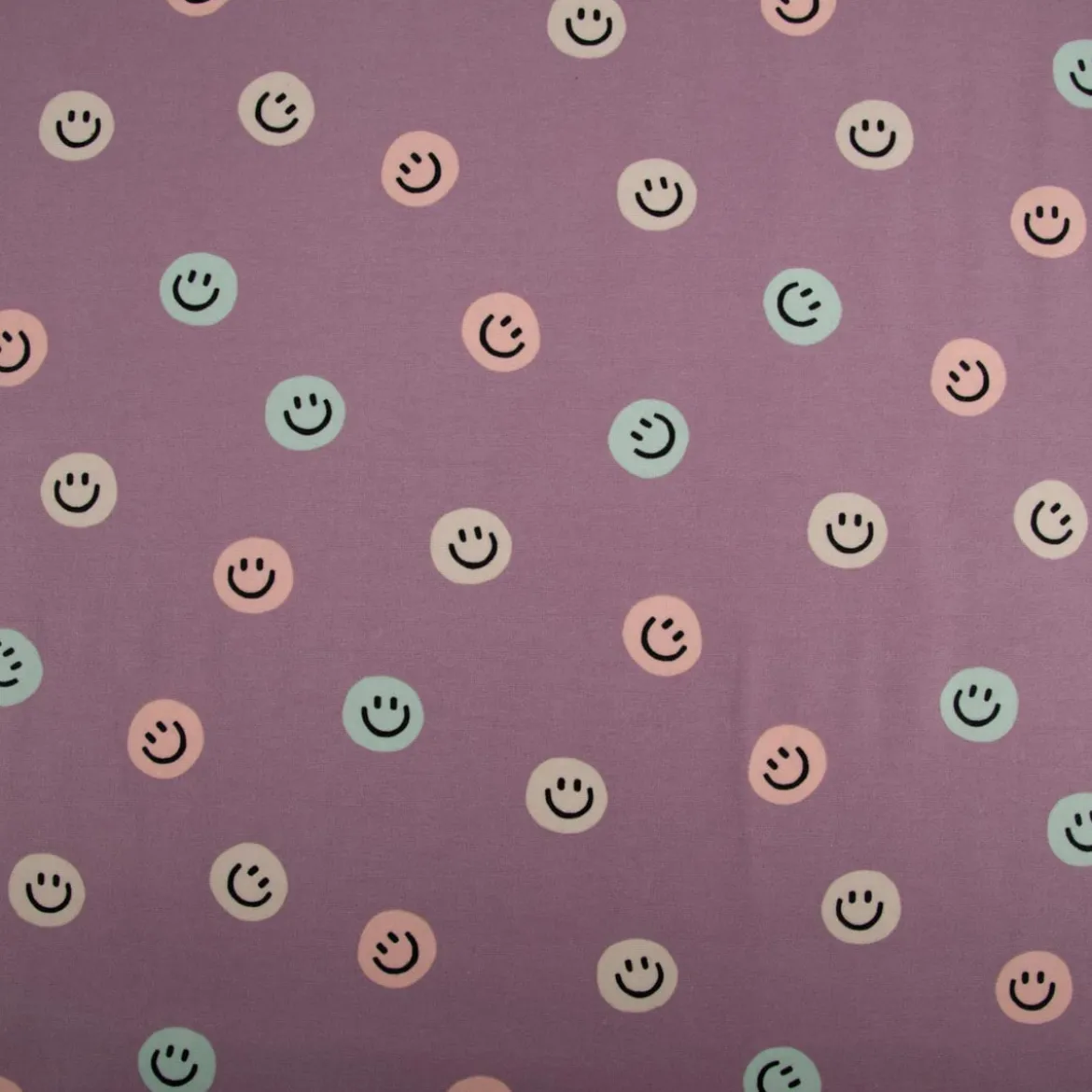 Flanellstoff aus Baumwolle Lachgesichter violett pastell 1,43m Breite
