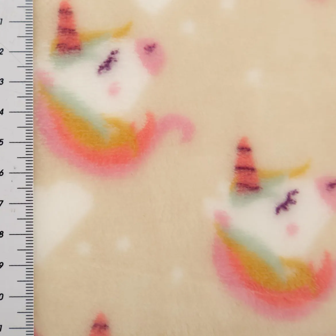 Fleecestoff Einhörner Regenbogen beige rosa 1,45 m Breite