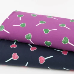 Jersey Stoff Baumwolljersey mit Glitter Lollypop lila grün 1,4m Breite
