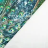 Samtstoff Pfau blau-grün – Digitaldruck mit leuchtendem Design