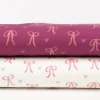 Sweatstoff aus Baumwolle Digitaldruck Schleifen fuchsia 1,50m Breite