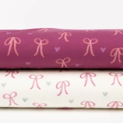 Sweatstoff aus Baumwolle Digitaldruck Schleifen fuchsia 1,50m Breite