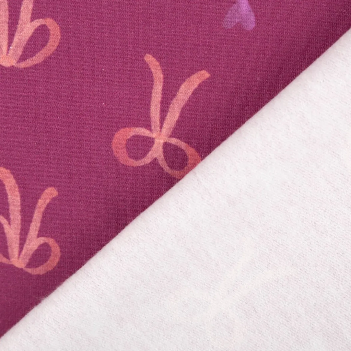 Sweatstoff aus Baumwolle Digitaldruck Schleifen fuchsia 1,50m Breite