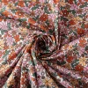 Tischdeckenstoff abwaschbar Baumwollstoff beschichtet Enduit Josette Blumen weiß orange 1,45m Breite