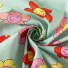 Tischdeckenstoff abwaschbar Baumwollstoff beschichtet HAPPY FLOWERS lachende Blumen mint grün rosa gelb 1,45m Breite