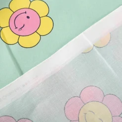 Tischdeckenstoff abwaschbar Baumwollstoff beschichtet HAPPY FLOWERS lachende Blumen mint grün rosa gelb 1,45m Breite